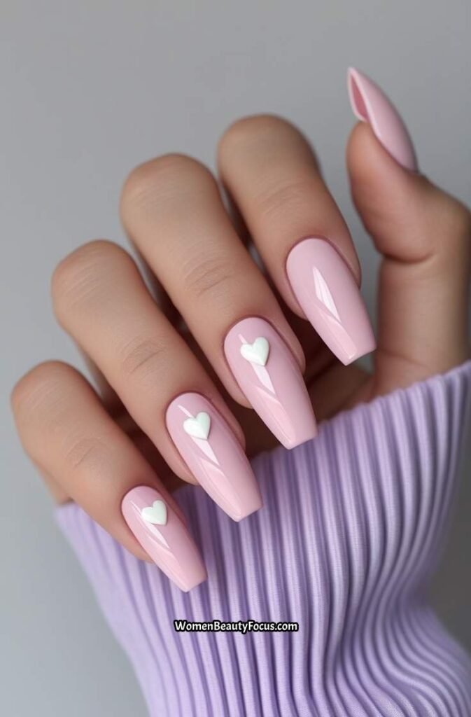 1. Baby Pink Coffin Nails with White Heart Accents