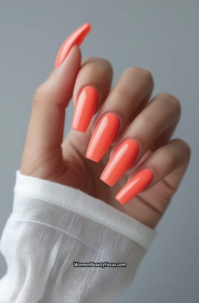 1. Bright Coral Coffin Nails with Glossy Finish