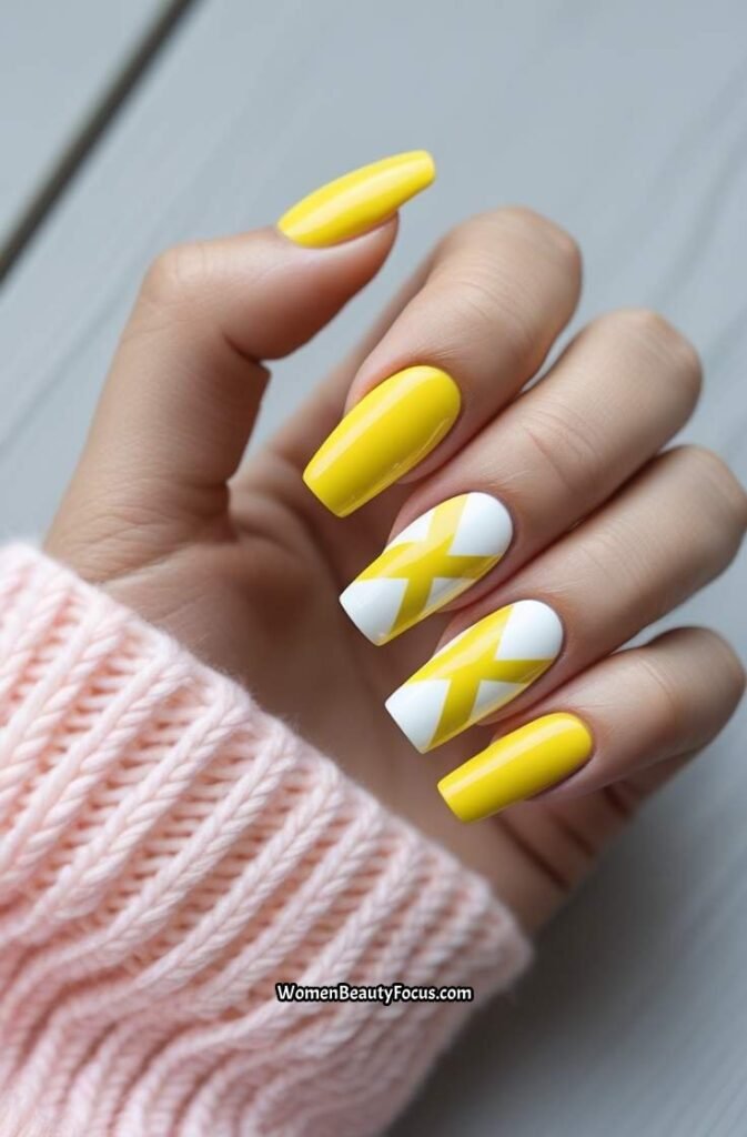 1. Bright Yellow and White Chevron Nails