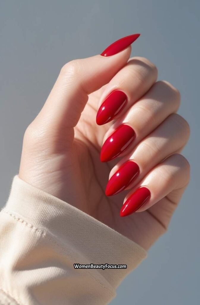 1. Classic Glossy Cherry Red Almond Nails