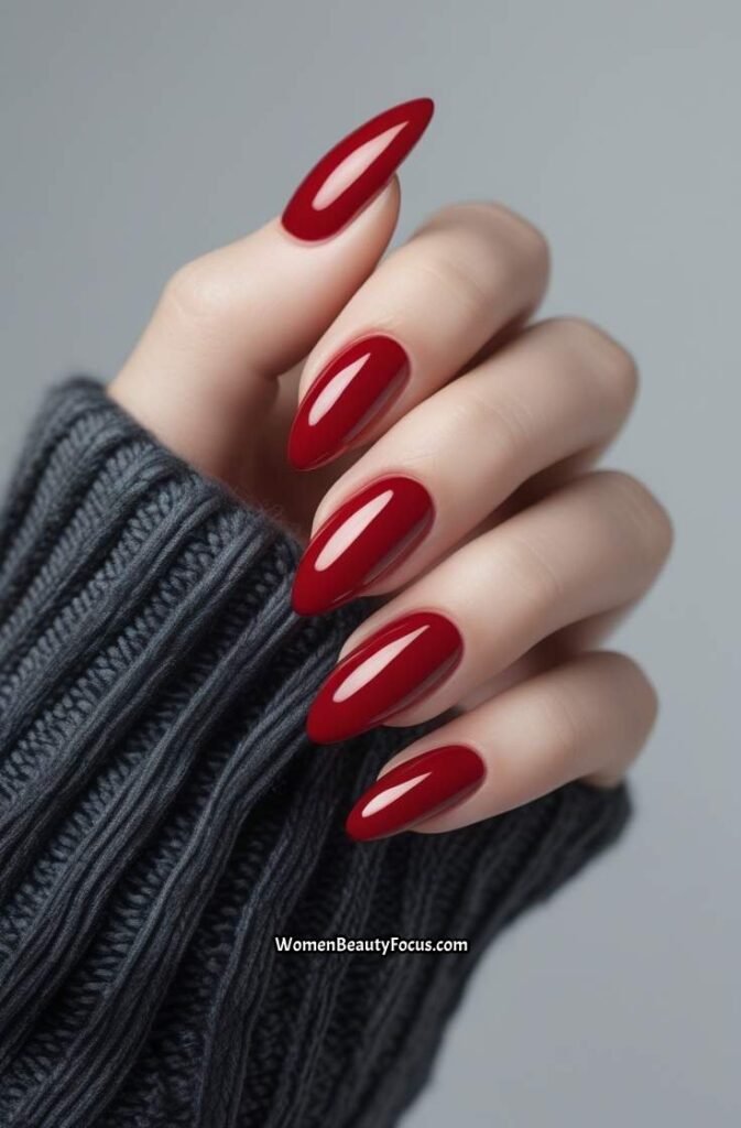 1. Classic Glossy Red Almond Nails