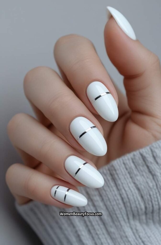 1. Glossy White Nails with Minimalist Design