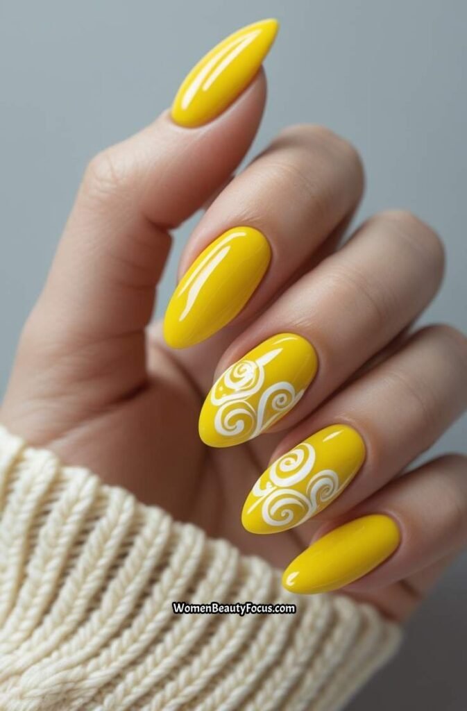 1. Glossy Yellow Nails with White Swirls