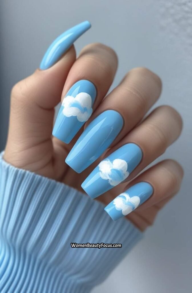 1. Sky Blue Coffin Nails with White Cloud Accents