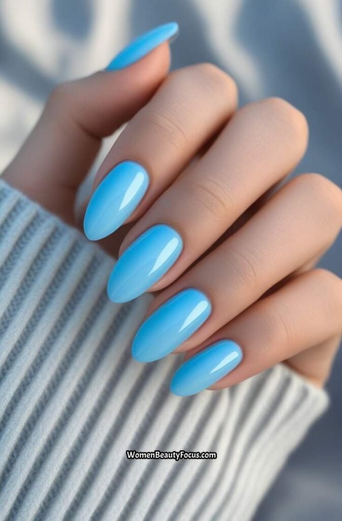 1. Sky Blue Glossy Almond Nails