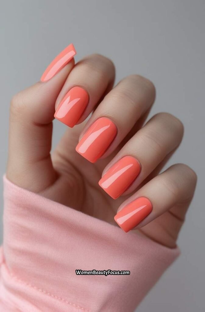 1. Soft Coral Square Nails with Glossy Finish