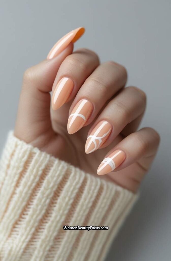 1. Soft Peach Almond Nails with Minimalist Art