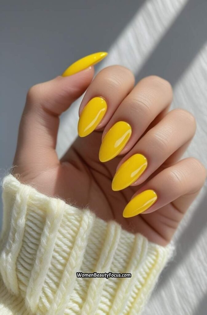 1. Sunshine Yellow Almond Nails with Glossy Finish