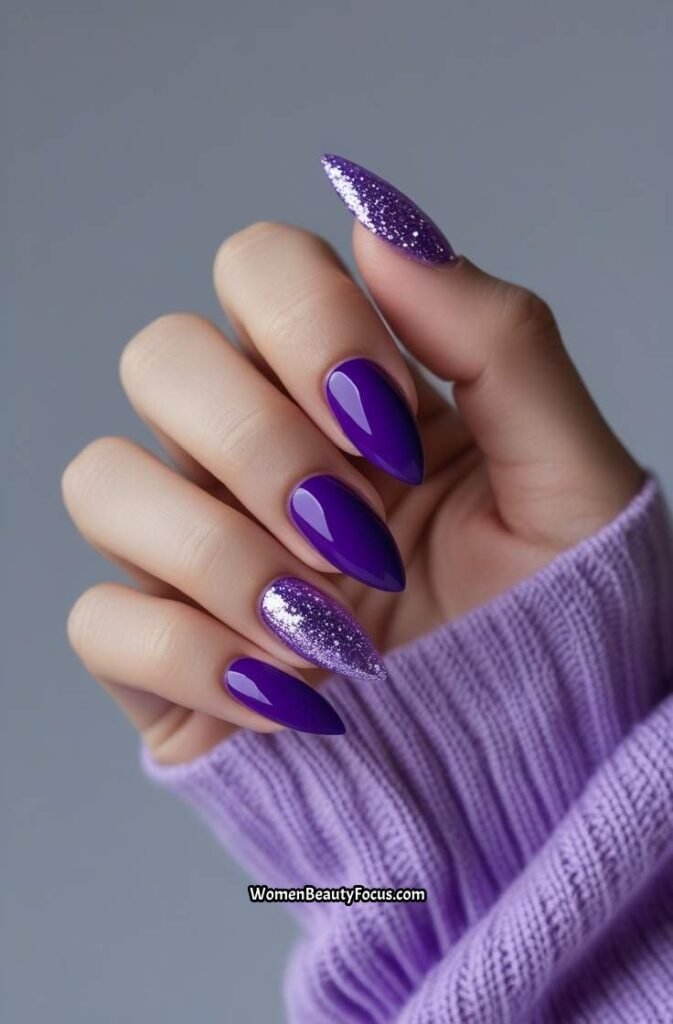 1. Vibrant Purple Stiletto Nails with Glitter Accents