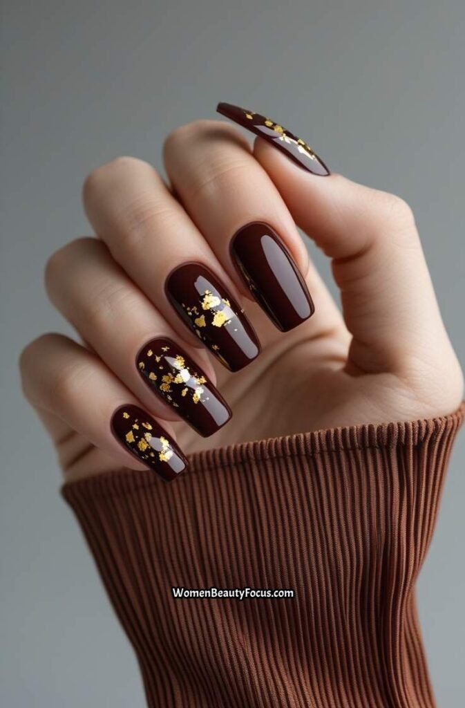 10. Cherry Brown Nails with Gold Foil Accents