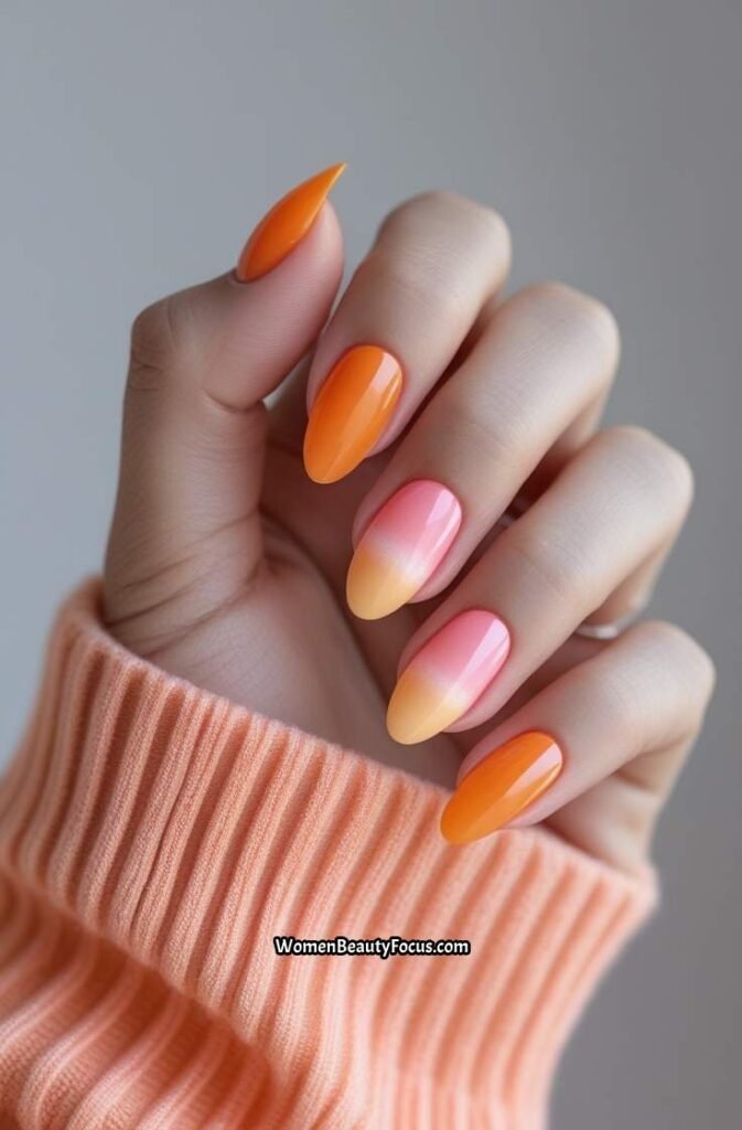 10. Tangerine Aura Nails with Pink Halo