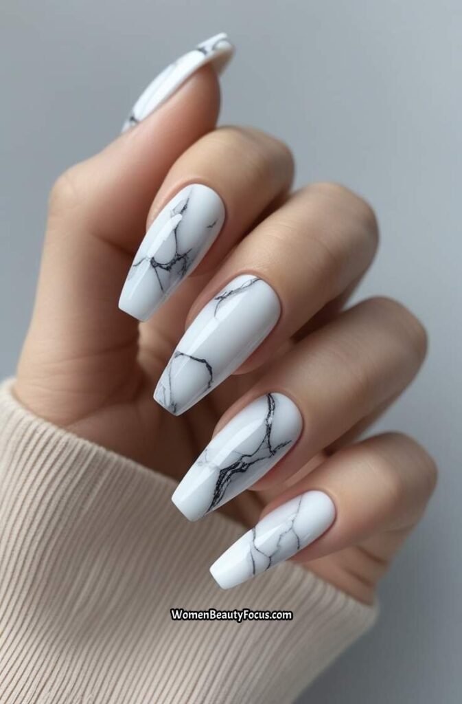 11. Elegant White Marble Nails