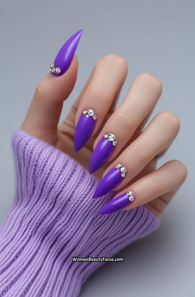 11. Purple Stiletto Nails with Rhinestones