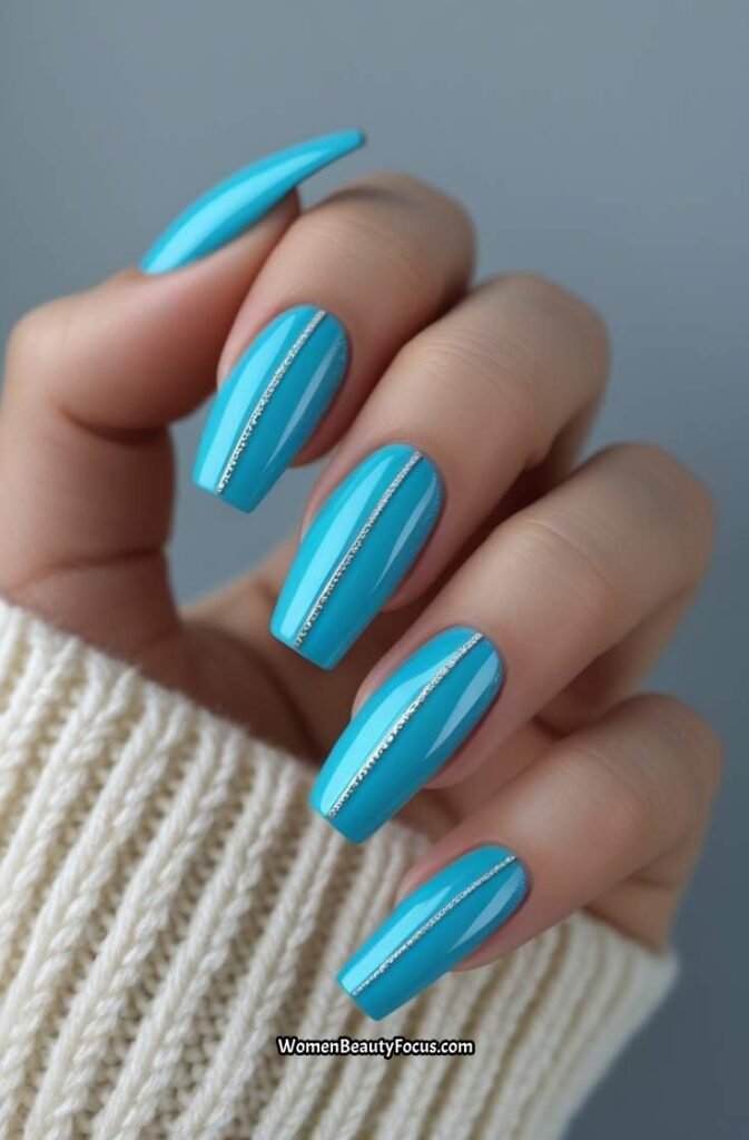 2. Aqua Blue Coffin Nails with Silver Lines