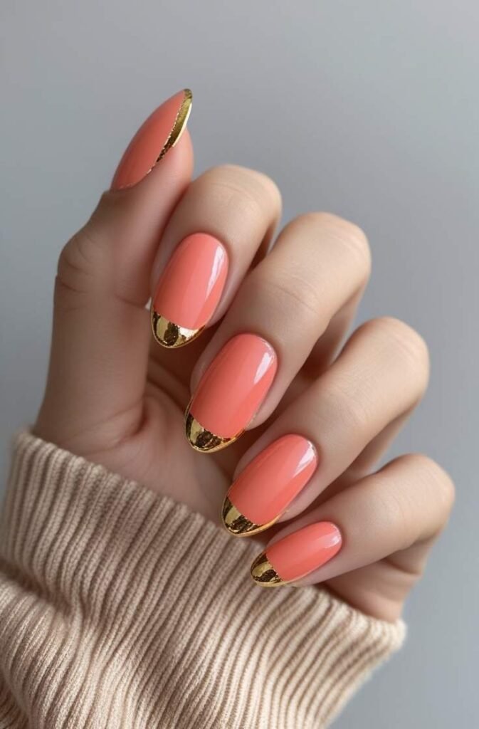 2. Coral and Gold French Tip Nails