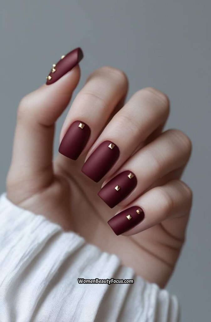 2. Matte Red Square Nails with Gold Studs