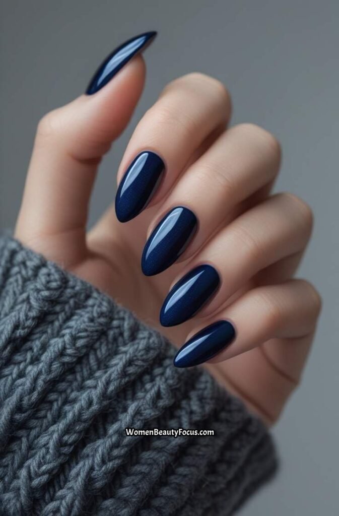 2. Midnight Blue Glossy Almond Nails