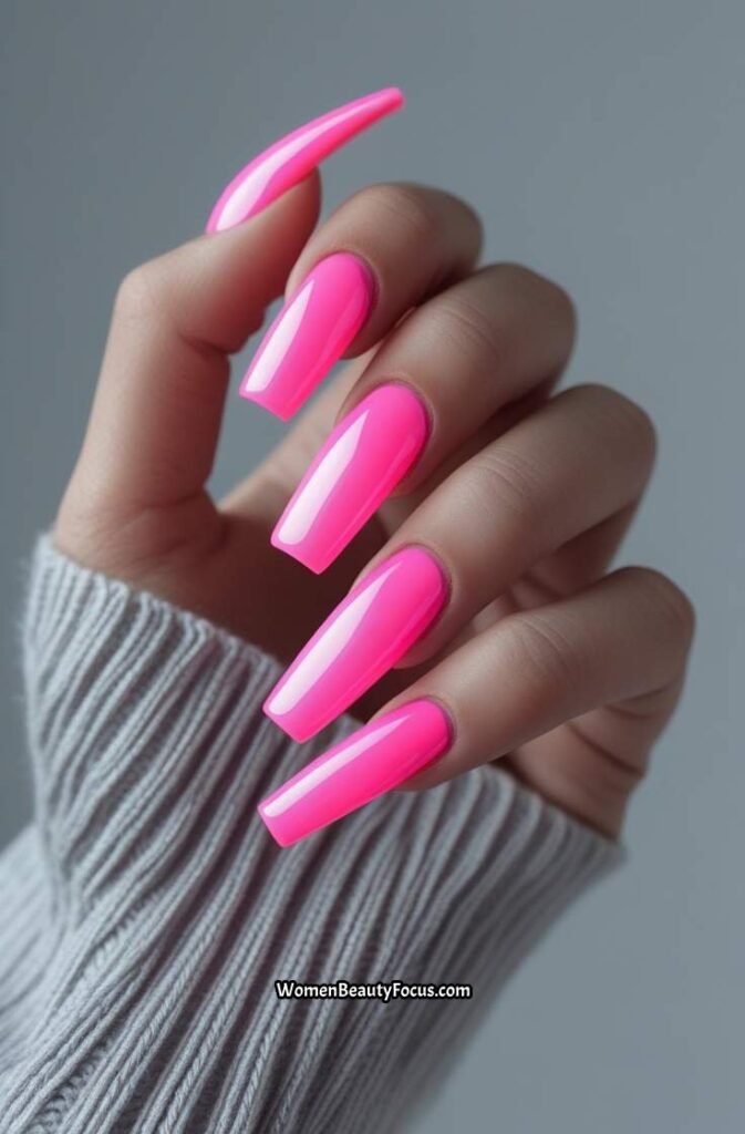 2. Neon Pink Coffin Nails with Subtle Chrome Glaze