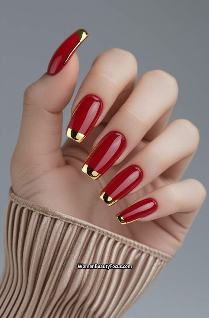 2. Red Glass Nails with Gold Chrome Tips