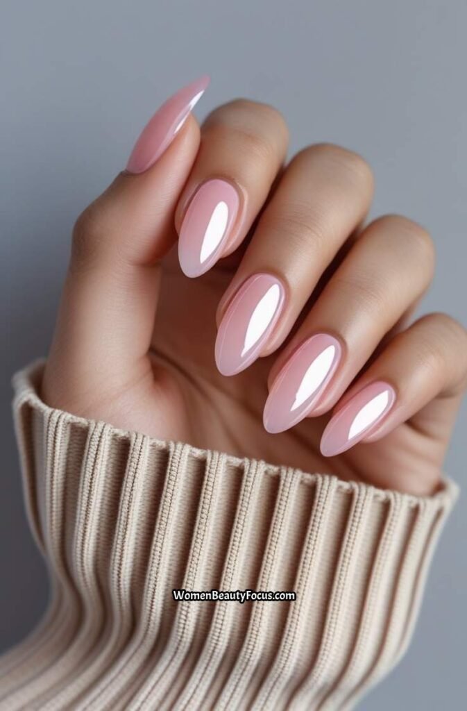 3. Peachy Coral Gel Nails with Glossy Finish