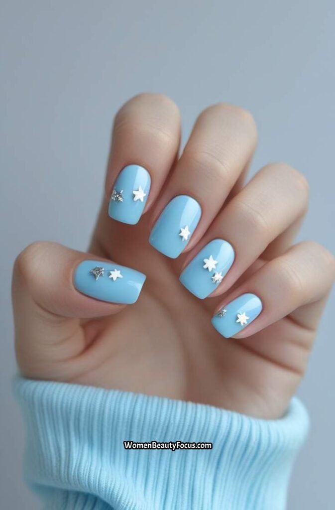 3. White and Silver Star Accents on Light Blue Nails