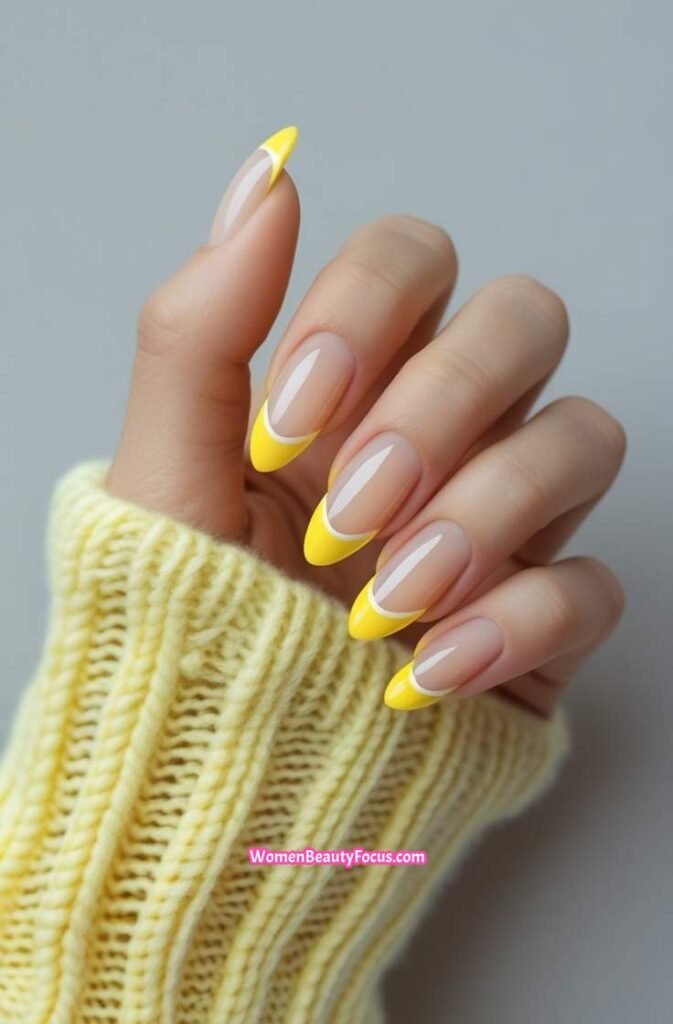 3. Yellow French Tips on Almond Nails