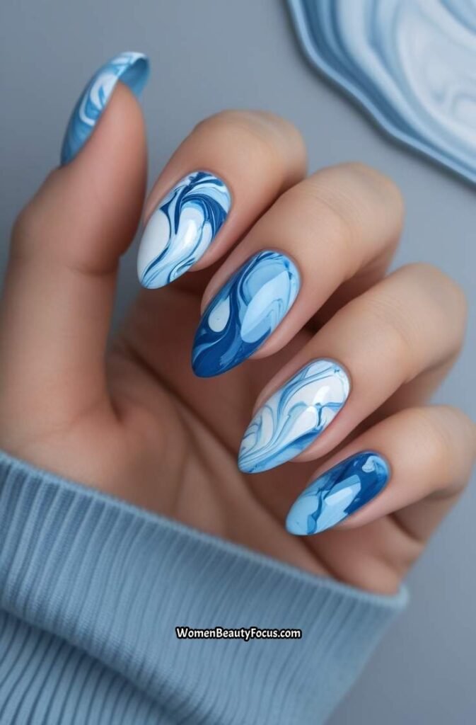4. Blue Marble Almond Nails