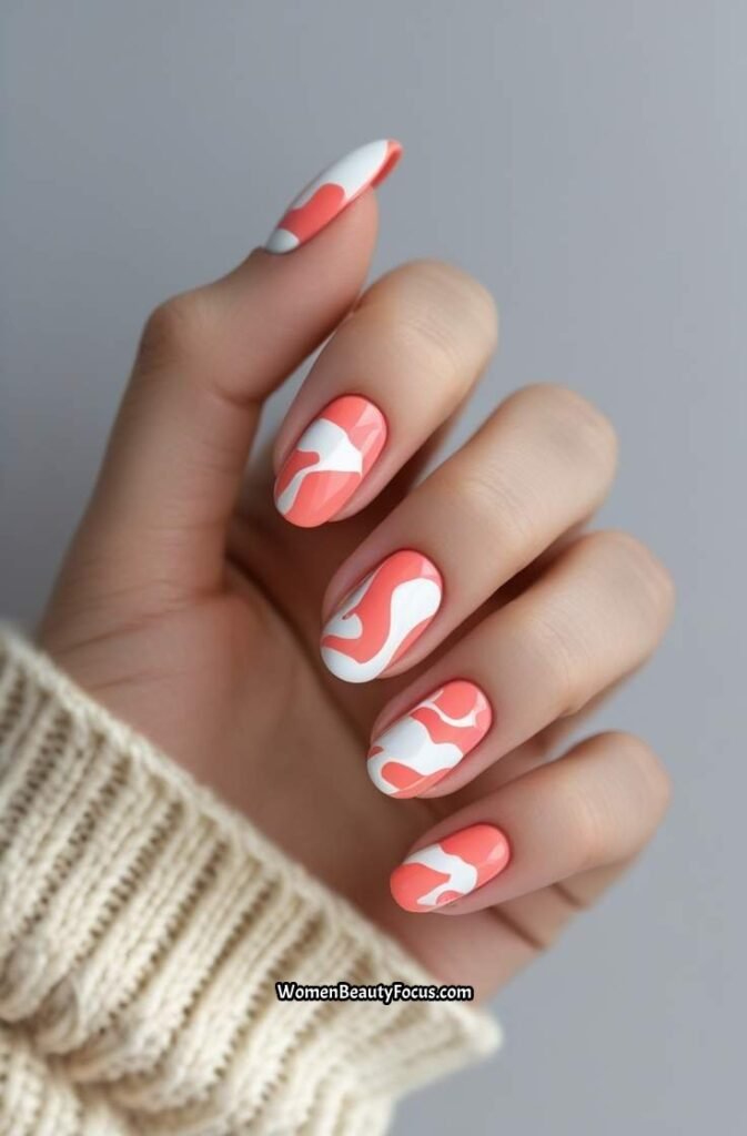 4. Coral Pink and White Abstract Nails