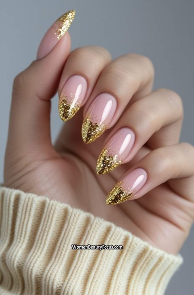 4. Short Acrylic Nails with Gold Glitter Tips