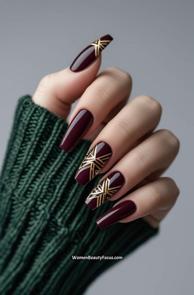 5. Bold Burgundy Nails with Geometric Art
