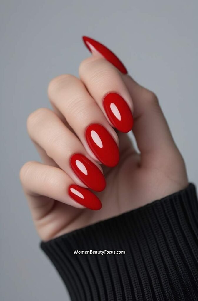 5. Classic Red Glossy Oval Nails
