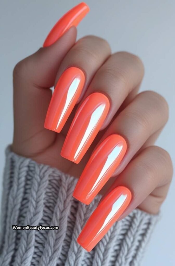 5. Neon Coral Coffin Nails with Chrome Finish
