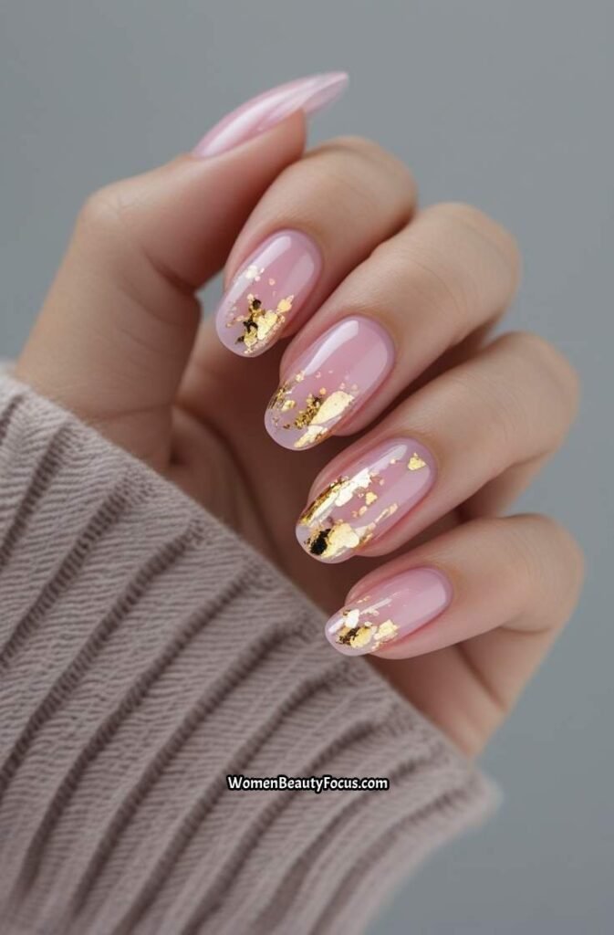 5. Sheer Pink Nails with Gold Flakes