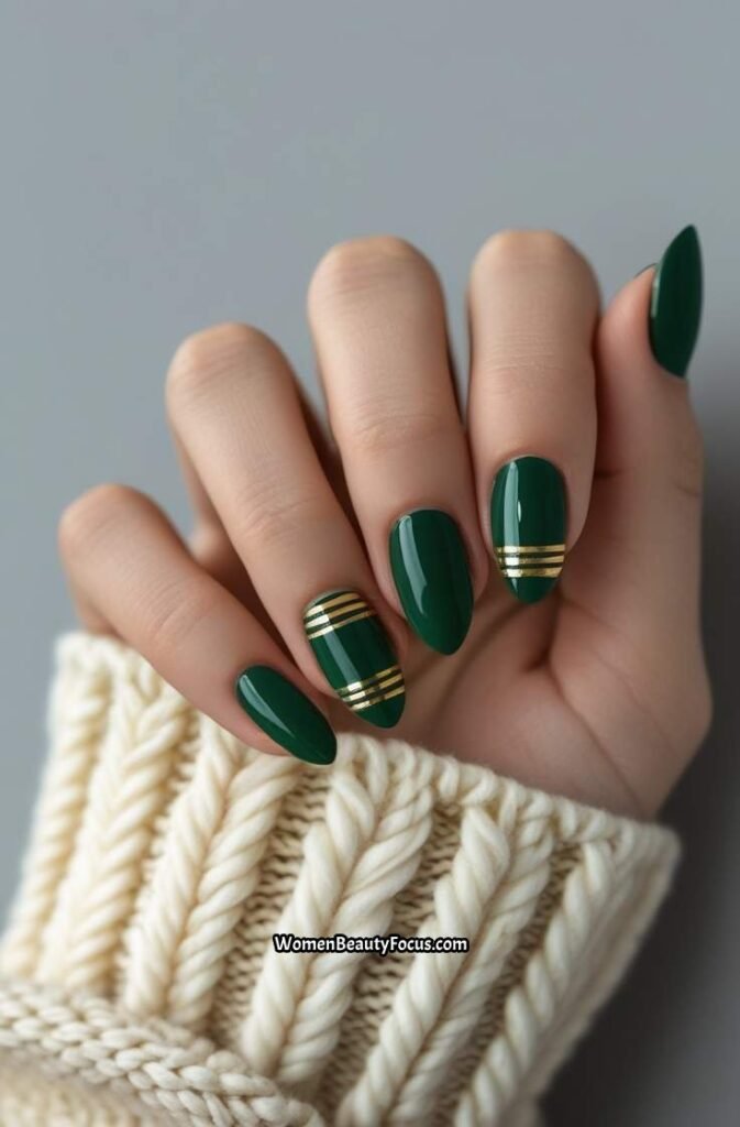 6. Forest Green Nails with Gold Stripe Accents
