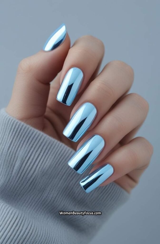 6. Sky Blue Chrome Nails