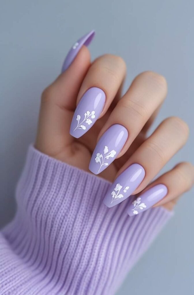 6. Soft Lavender Nails with White Floral Details