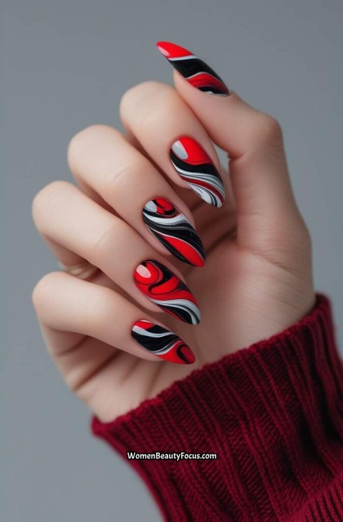 7. Bold Red and Black Marble Nails