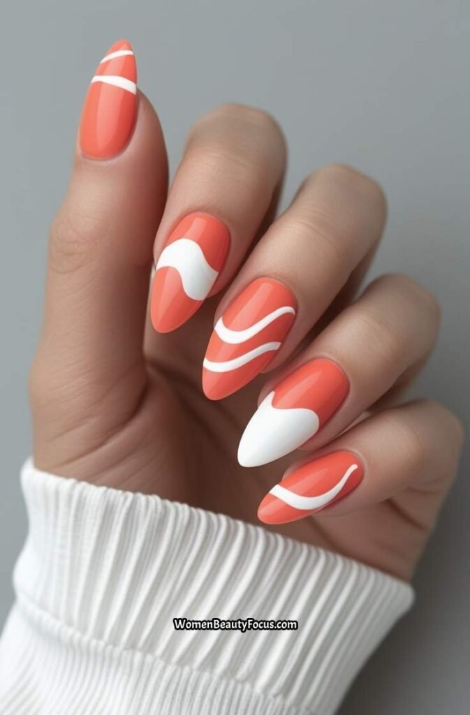7. Coral and White Abstract Wave Nails
