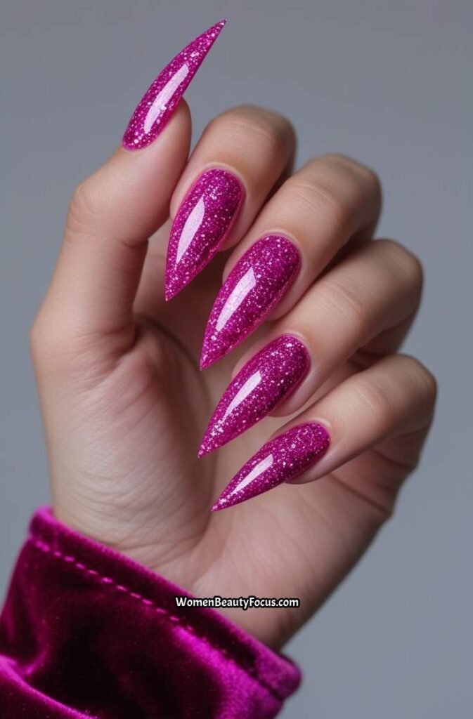 7. Hot Pink Glitter Stiletto Nails