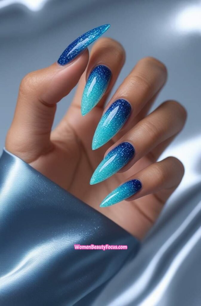 7. Ocean Blue Glitter Ombre Nails