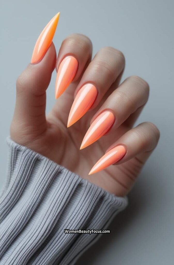 7. Peachy Neon Acrylic Nails