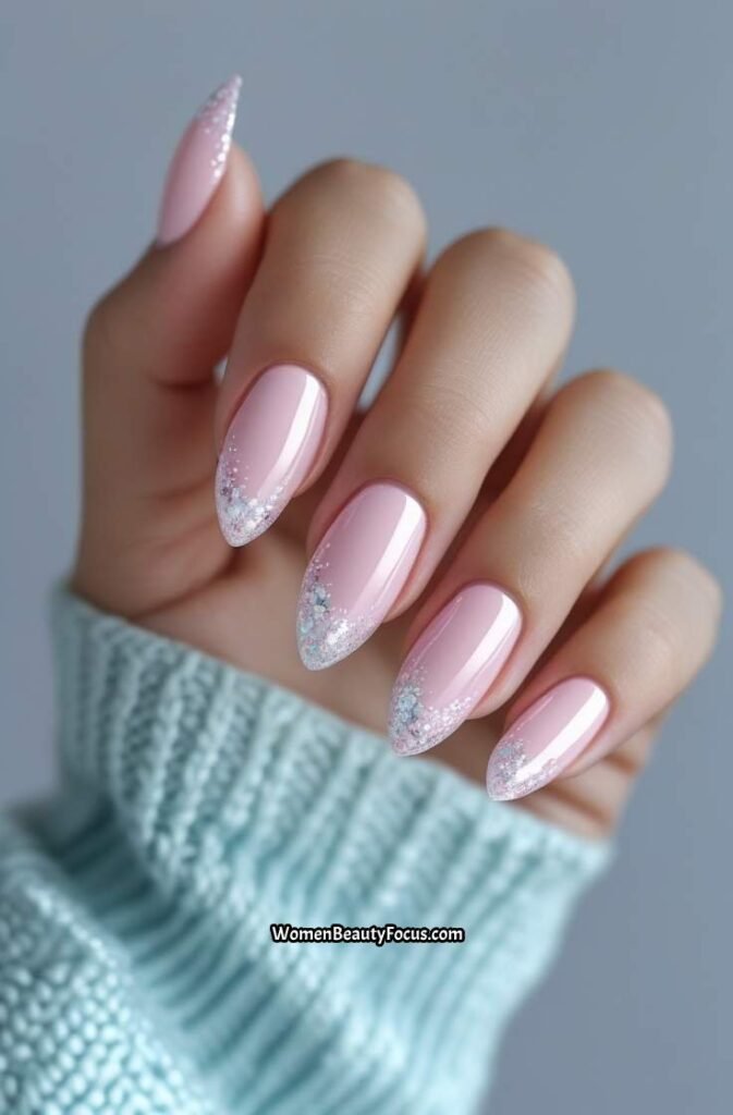 7. Soft Pink Almond Nails with Glitter Accents