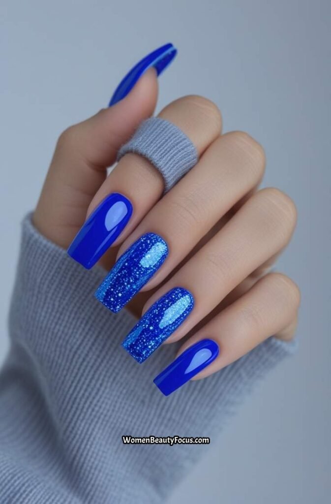 8. Bold Blue Square Nails with Glitter Accent