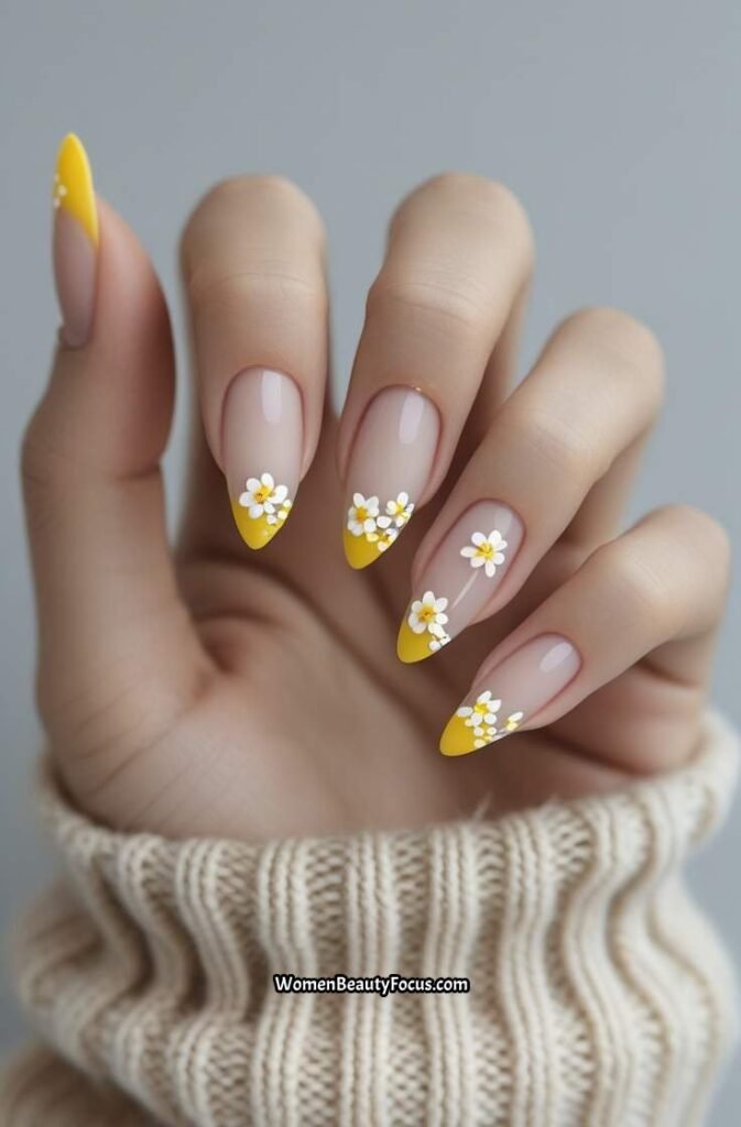 8. Dainty Yellow Floral Tips on Almond Nails