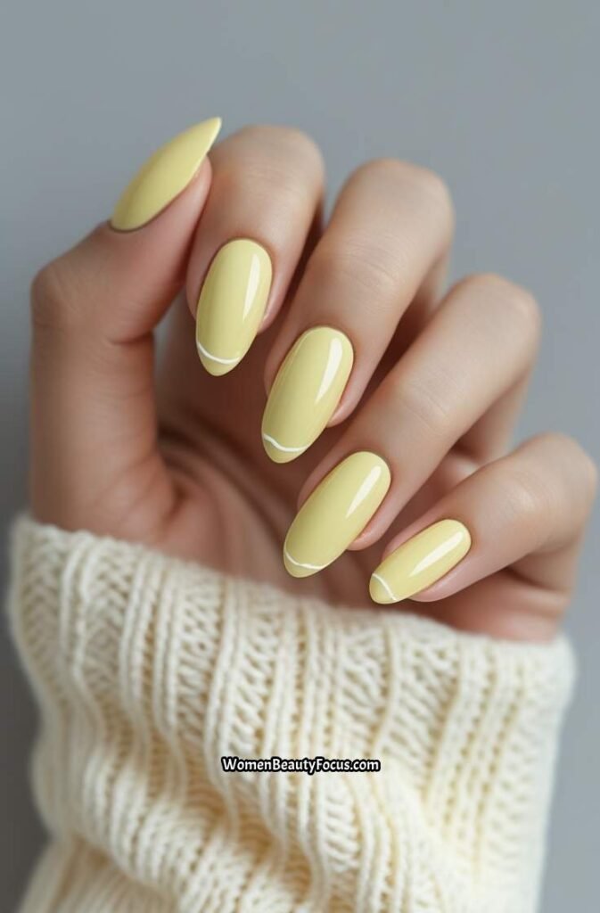 8. Pale Yellow Almond Nails with White Liner