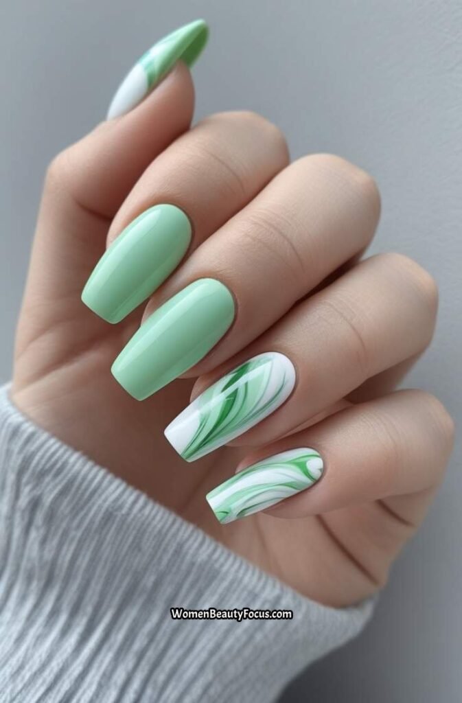 8. Soft Mint Green Nails with Marble Accents