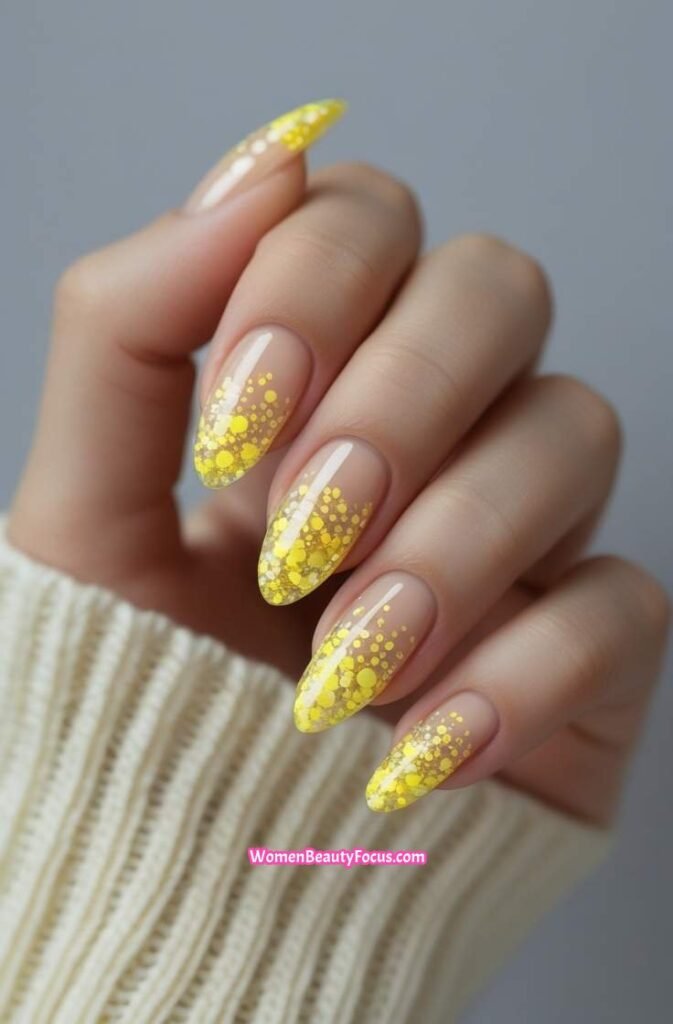 9. Yellow Glitter Tips on Clear Base