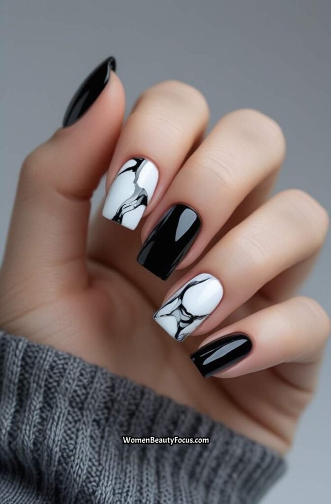 1. Bold Black and White Marble Nails