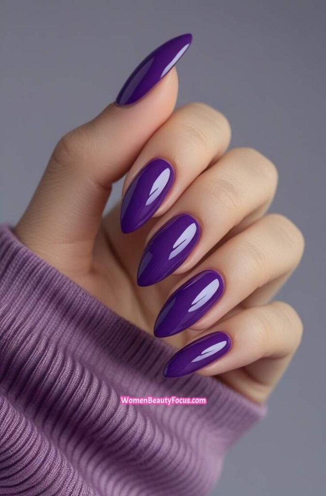 1. Classic Glossy Purple Almond Nails