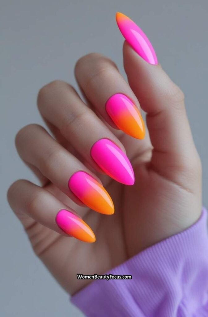 1. Neon Pink and Orange Gradient Nails